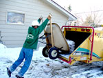 Joe dumps logs into the woodchipper